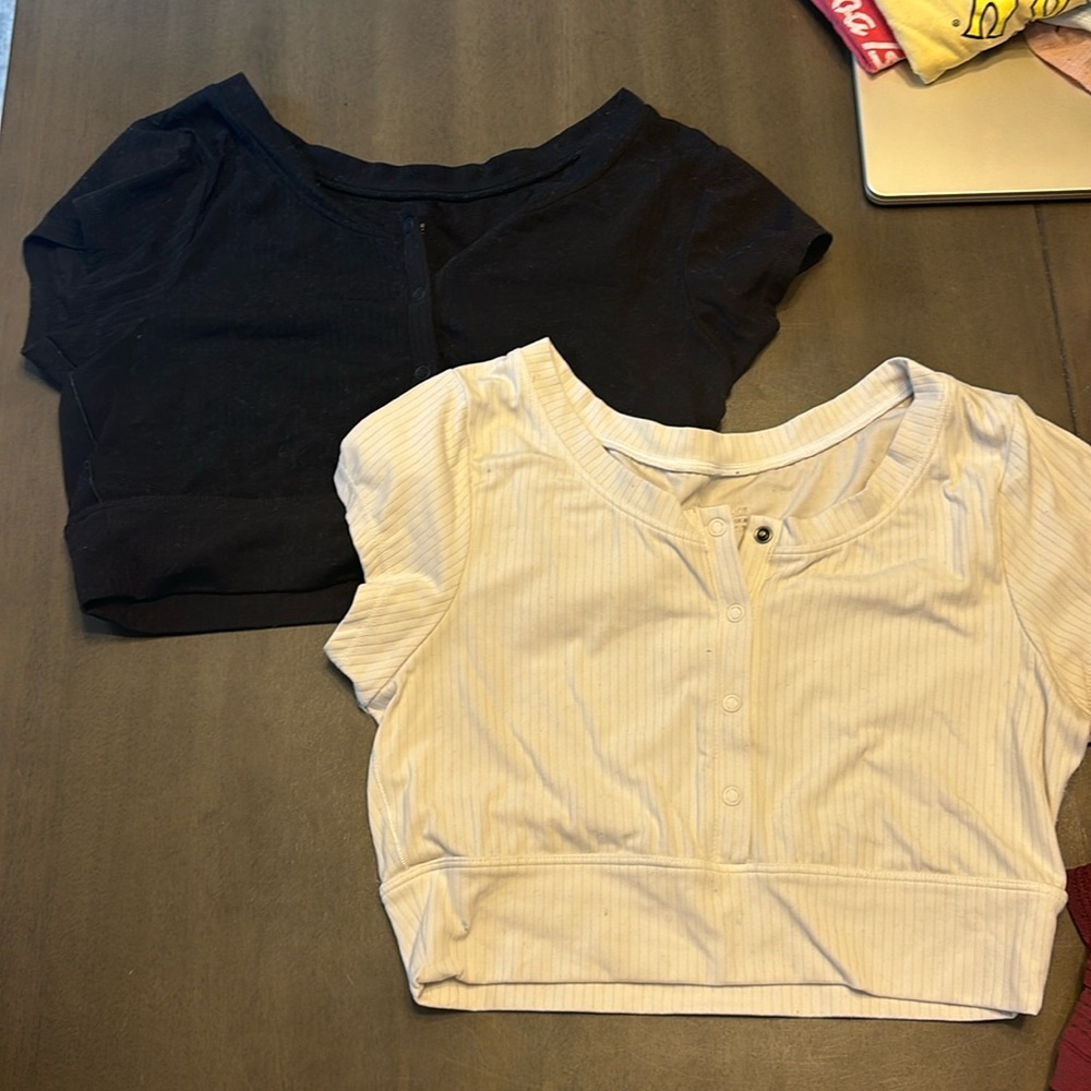 TWO aerie button top crops